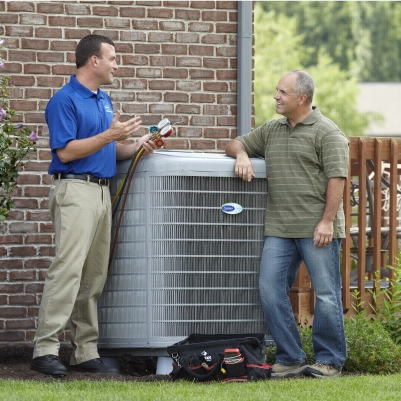 carrier tech talking with man in front of unit